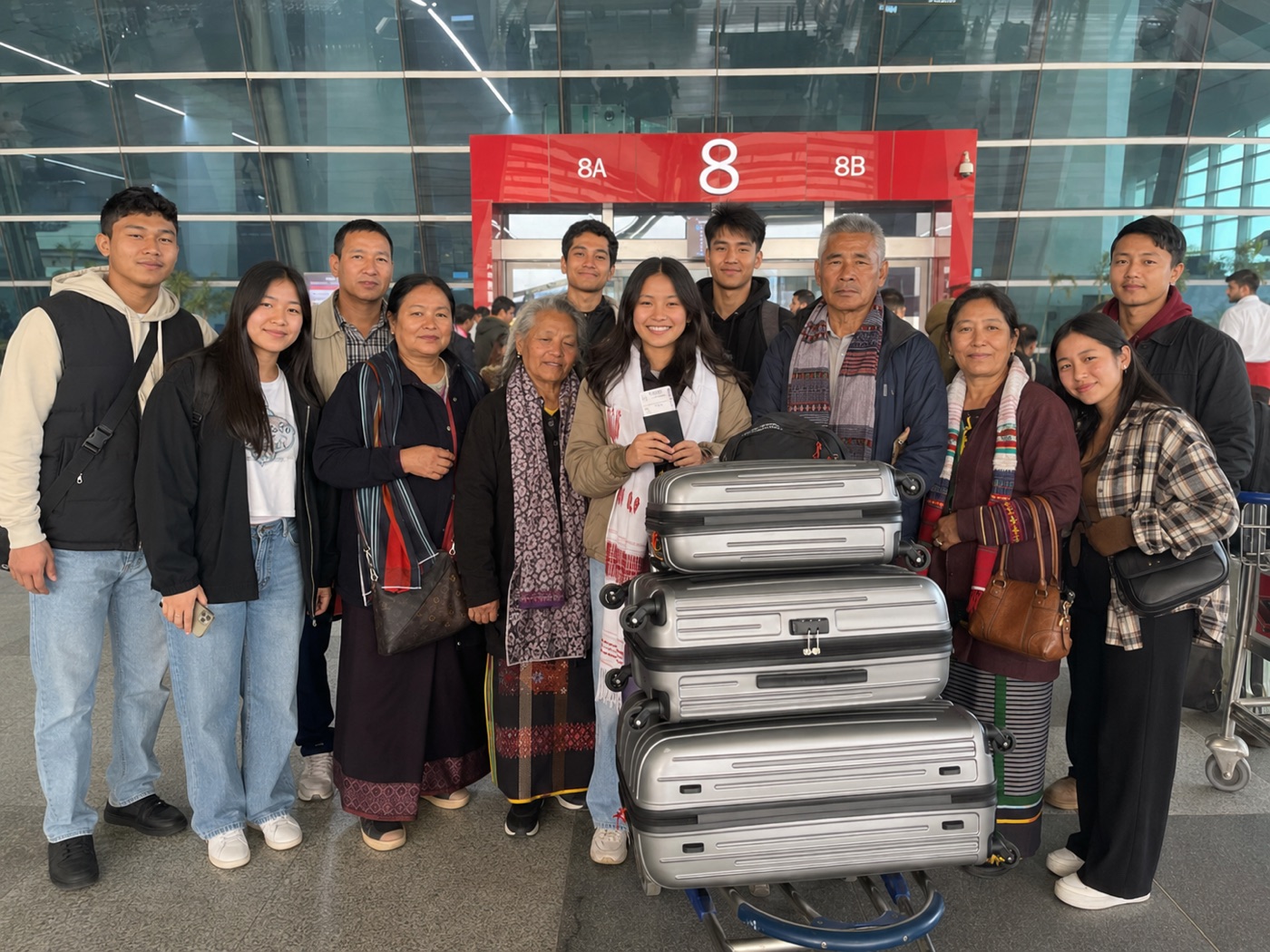 Students at the airport before departure.